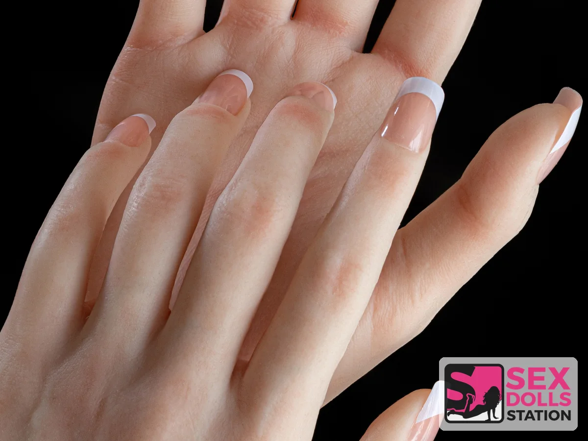Close view of articulated doll hands and finger detail